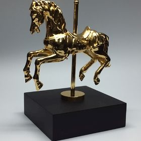 Metallguss-Trophäe "Goldenes Karusellpferd"